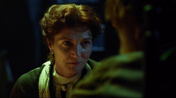 Movie still from “In the Heart of the Sea” (2015), directed by Ron Howard – An older woman is looking at a younger man; Close Up shot, Over the shoulder angle