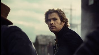 Movie still from “In the Heart of the Sea” (2015), directed by Ron Howard – A person with long hair; Close Up shot, Over the shoulder angle