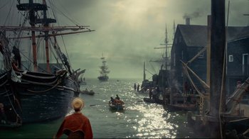 Movie still from “In the Heart of the Sea” (2015), directed by Ron Howard – A man is in a boat in the middle of the water; Extreme Wide shot, High angle