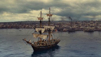 Movie still from “In the Heart of the Sea” (2015), directed by Ron Howard – An old pirate ship in the water; Extreme Wide shot, High angle
