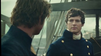 Movie still from “In the Heart of the Sea” (2015), directed by Ron Howard – A man in a blue jacket looking at himself in the mirror; Close Up shot, Over the shoulder angle