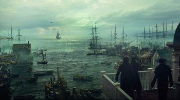Movie still from “In the Heart of the Sea” (2015), directed by Ron Howard – A group of people standing on a pier looking out to sea; Extreme Wide shot, High angle