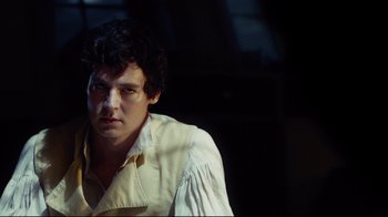 Movie still from “In the Heart of the Sea” (2015), directed by Ron Howard – A man in a white shirt and a yellow shirt; Close Up shot, Over the shoulder angle