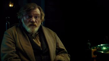 Movie still from “In the Heart of the Sea” (2015), directed by Ron Howard – An old man with a beard and a mustache wearing a brown jacket; Close Up shot, Over the shoulder angle
