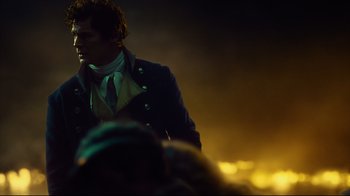 Movie still from “In the Heart of the Sea” (2015), directed by Ron Howard – A man standing in front of a group of people; Medium shot, Over the shoulder angle