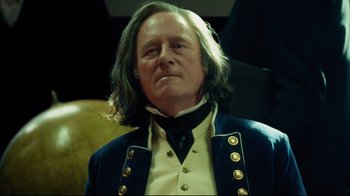 Movie still from “In the Heart of the Sea” (2015), directed by Ron Howard – A person wearing a suit and tie; Close Up shot, Over the shoulder angle