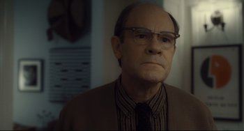Movie still from “Inside Llewyn Davis” (2013), directed by Ethan Coen – An older man wearing glasses and wearing a sweater; Close Up shot, Low angle