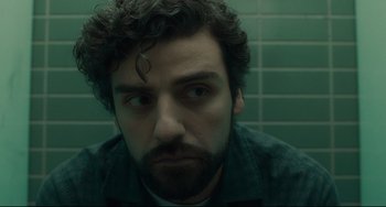 Movie still from “Inside Llewyn Davis” (2013), directed by Ethan Coen – A person with a beard looking at the camera; Close Up shot, Over the shoulder angle