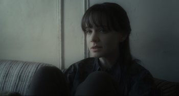 Movie still from “Inside Llewyn Davis” (2013), directed by Ethan Coen – A woman sitting on a couch looking out a window; Close Up shot, Over the shoulder angle