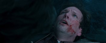 Movie still from “Insomnia” (2002), directed by Christopher Nolan – A man with blood all over his face and head; Close Up shot, Overhead angle
