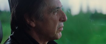 Movie still from “Insomnia” (2002), directed by Christopher Nolan – An older man looking off into the distance; Close Up shot, Over the shoulder angle