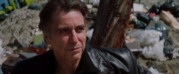 Movie still from “Insomnia” (2002), directed by Christopher Nolan – A person wearing a leather jacket; Close Up shot, Low angle