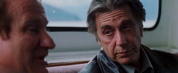 Movie still from “Insomnia” (2002), directed by Christopher Nolan – An older man looking at the camera; Close Up shot, Over the shoulder angle