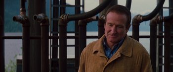 Movie still from “Insomnia” (2002), directed by Christopher Nolan – A person wearing a jacket; Close Up shot, Over the shoulder angle