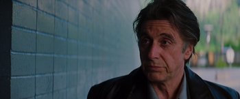 Movie still from “Insomnia” (2002), directed by Christopher Nolan – A person wearing a jacket; Close Up shot, Low angle