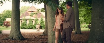 Movie still from “Irrational Man” (2015), directed by Woody Allen – A man and a woman standing next to a tree; Medium shot, Over the shoulder angle