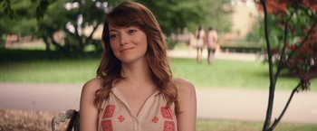 Movie still from “Irrational Man” (2015), directed by Woody Allen – A beautiful young lady with long brown hair; Close Up shot, Over the shoulder angle