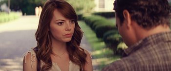 Movie still from “Irrational Man” (2015), directed by Woody Allen – A woman with long brown hair is looking at another woman; Close Up shot, Over the shoulder angle