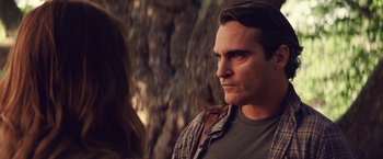 Movie still from “Irrational Man” (2015), directed by Woody Allen – A man and a woman standing next to each other; Close Up shot, Over the shoulder angle