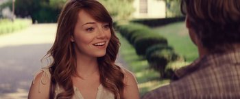 Movie still from “Irrational Man” (2015), directed by Woody Allen – A beautiful young woman with long brown hair; Close Up shot, Over the shoulder angle