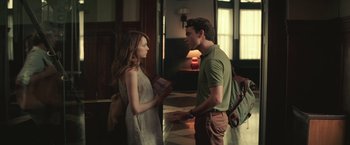 Movie still from “Irrational Man” (2015), directed by Woody Allen – A man and a woman standing next to each other; Medium shot, Over the shoulder angle