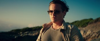 Movie still from “Irrational Man” (2015), directed by Woody Allen – A man wearing sunglasses and a jacket; Close Up shot, Low angle