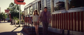 Movie still from “Irrational Man” (2015), directed by Woody Allen – A man and a woman walking down the stairs; Medium shot, Over the shoulder angle