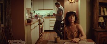 Movie still from “Irrational Man” (2015), directed by Woody Allen – A man and a woman in a kitchen; Medium shot, Over the shoulder angle