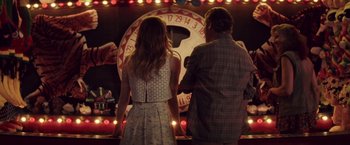 Movie still from “Irrational Man” (2015), directed by Woody Allen – A man and a woman standing in front of a large clock; Medium shot, Over the shoulder angle