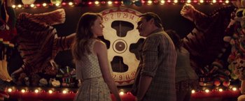Movie still from “Irrational Man” (2015), directed by Woody Allen – A man and a woman standing next to each other in front of a clock; Medium shot, Over the shoulder angle