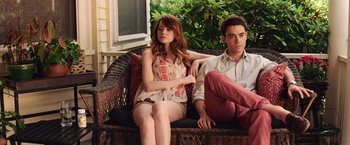 Movie still from “Irrational Man” (2015), directed by Woody Allen – A man and a woman sitting on a porch swing; Medium shot, Low angle