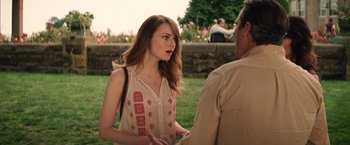 Movie still from “Irrational Man” (2015), directed by Woody Allen – A woman talking to a man in front of a wall; Medium shot, Over the shoulder angle