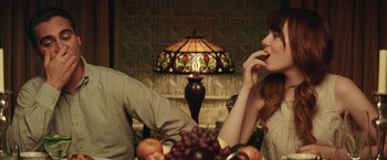 Movie still from “Irrational Man” (2015), directed by Woody Allen – A man and a woman sitting in front of a lamp; Medium shot, Over the shoulder angle