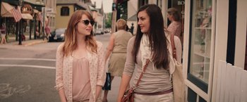 Movie still from “Irrational Man” (2015), directed by Woody Allen – Two women walking down a street talking to each other; Medium shot, Over the shoulder angle