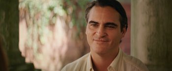 Movie still from “Irrational Man” (2015), directed by Woody Allen – A person wearing a button up shirt; Close Up shot, Over the shoulder angle