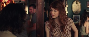 Movie still from “Irrational Man” (2015), directed by Woody Allen – A woman with long red hair standing next to a man; Close Up shot, Over the shoulder angle