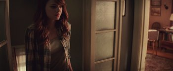 Movie still from “Irrational Man” (2015), directed by Woody Allen – A woman standing in front of a door; Medium shot, Over the shoulder angle