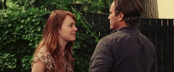 Movie still from “Irrational Man” (2015), directed by Woody Allen – A man and a woman are standing next to each other; Close Up shot, Over the shoulder angle