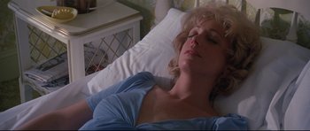 Movie still from “Jaws” (1975), directed by Steven Spielberg – A woman laying in a hospital bed with her eyes closed; Close Up shot, High angle