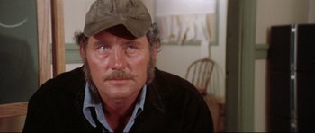 Movie still from “Jaws” (1975), directed by Steven Spielberg – A person wearing a hat; Close Up shot, High angle