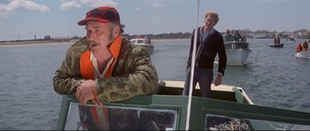 Movie still from “Jaws” (1975), directed by Steven Spielberg – Two men on a boat in the water; Medium shot, Over the shoulder angle