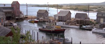 Movie still from “Jaws” (1975), directed by Steven Spielberg – A boat in the water next to a dock; Extreme Wide shot, High angle