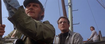 Movie still from “Jaws” (1975), directed by Steven Spielberg – Two men standing next to each other on a boat; Close Up shot, Low angle