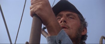 Movie still from “Jaws” (1975), directed by Steven Spielberg – A person with a hat on; Close Up shot, Low angle