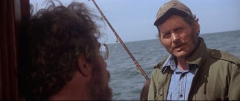 Movie still from “Jaws” (1975), directed by Steven Spielberg – Two men on a boat with a fishing pole; Close Up shot, Over the shoulder angle