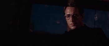Movie still from “Jaws” (1975), directed by Steven Spielberg – A person wearing glasses in the dark; Close Up shot, Low angle