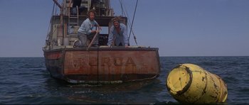 Movie still from “Jaws” (1975), directed by Steven Spielberg – Two people on a boat in the water; Wide shot, Low angle