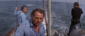 Movie still from “Jaws” (1975), directed by Steven Spielberg – Two men on a boat in the water; Medium shot, Low angle
