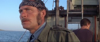 Movie still from “Jaws” (1975), directed by Steven Spielberg – A person wearing a bandana; Close Up shot, Low angle