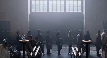 Movie still from “Joy” (2015), directed by David O. Russell – A group of people standing in front of a window; Extreme Wide shot, High angle